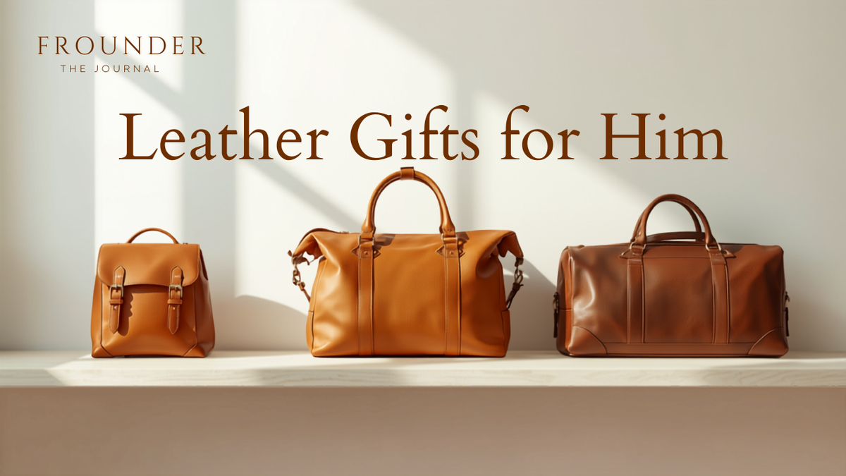 Leather gifts for him — a Frounder tan leather backpack, work tote and weekender duffel lined up by size on a pale oak console table in bright daylight