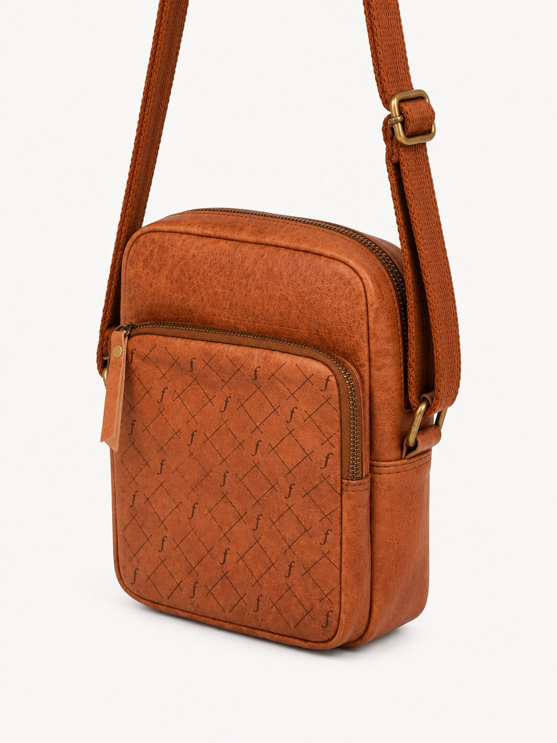 Brown crossbody bag with woven pattern on a light gray background