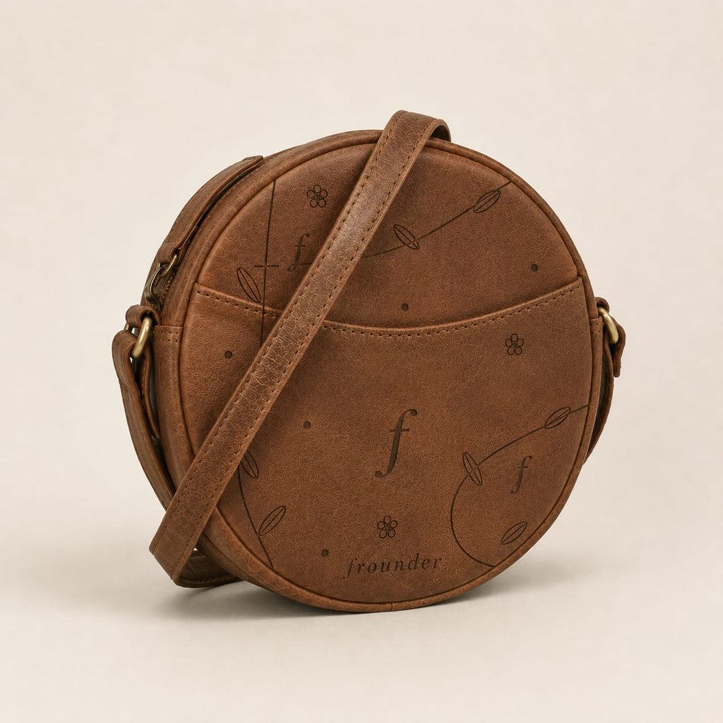 Frounder Orbit round leather crossbody bag with engraved monogram pattern