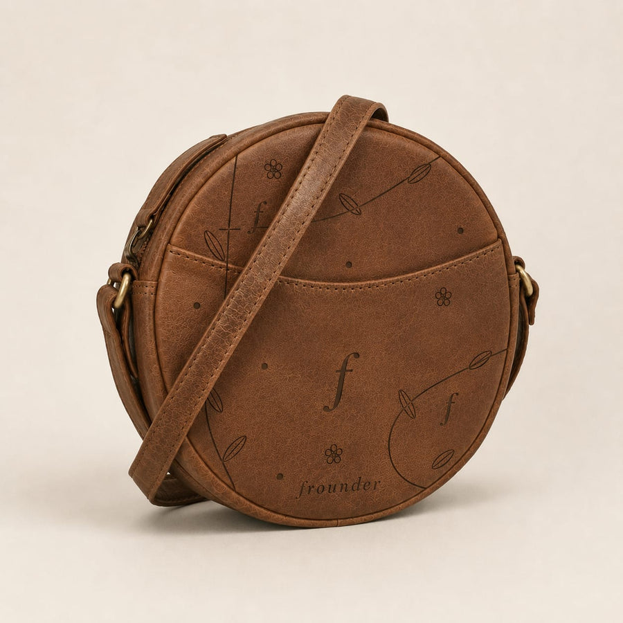 Frounder Orbit round leather crossbody bag with engraved monogram pattern