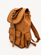 Brown leather backpack on a white background