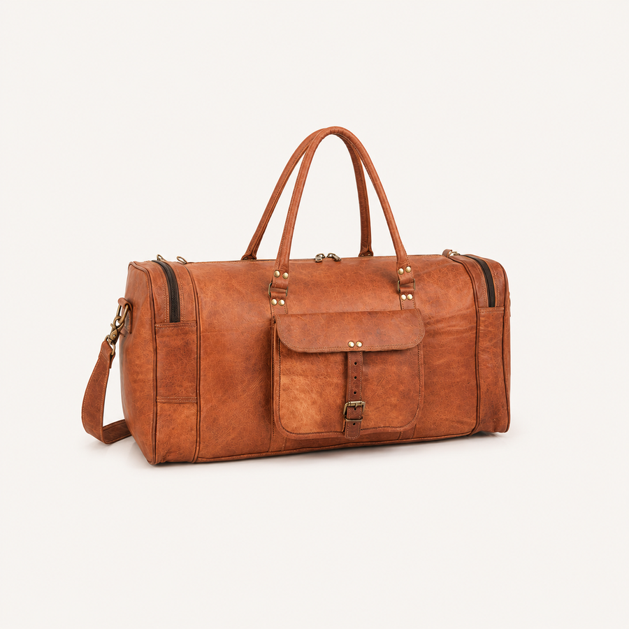 A brown distressed leather duffel bag with dual top handles, a front flap pocket with a buckle strap, and a detachable shoulder strap, shown on a light cream background.