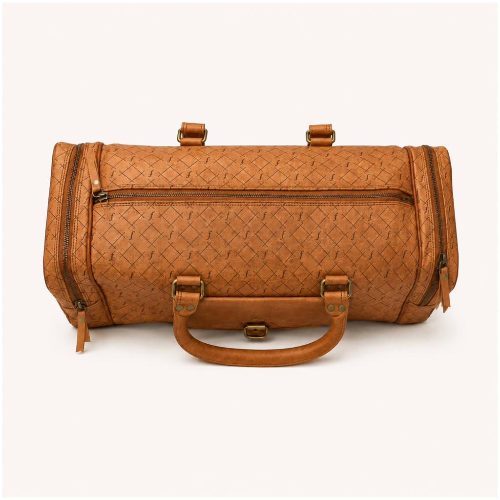 Top view of the Frounder Jupiter leather duffel showing the rolled handles and engraved weave